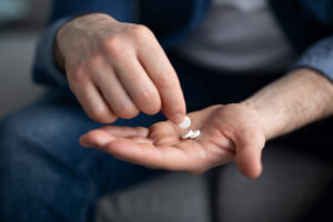 A person looks at their prescription medication.