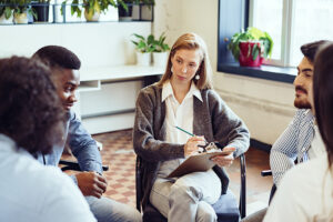 People participate in group therapy as part of an IOP program.