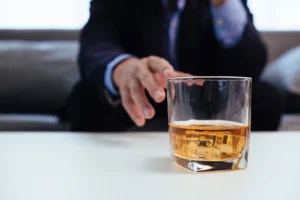 A person struggles with alcohol addiction.