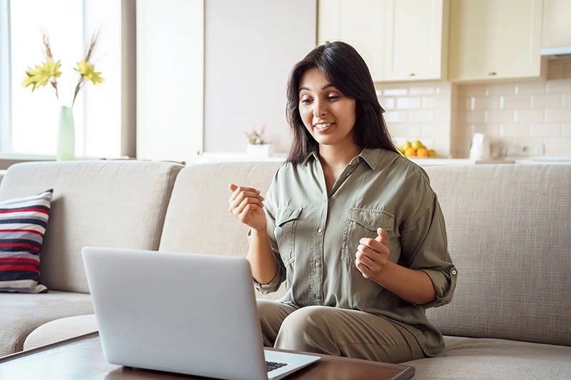 A person participates in a virtual AA meeting.